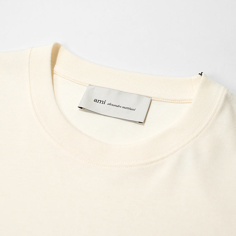 【2026SS SUMMER SALE】AMI メンズ Tシャツ AMI PARIS UTS380 726 BLANC CREME ホワイトクリーム 136