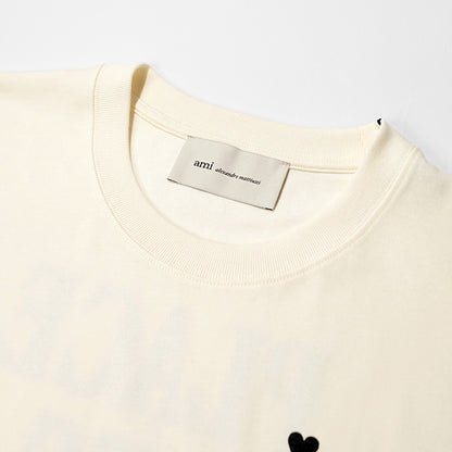 【2026SS SUMMER SALE】AMI メンズ Tシャツ AMI DE COEUR UTS387 726 BLANC CREME ホワイトクリーム 136