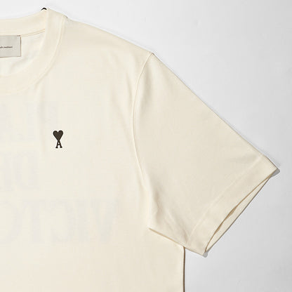 【2026SS SUMMER SALE】AMI メンズ Tシャツ AMI DE COEUR UTS387 726 BLANC CREME ホワイトクリーム 136