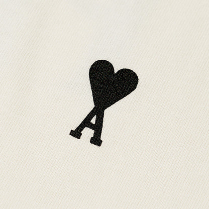 【2026SS SUMMER SALE】AMI メンズ Tシャツ AMI DE COEUR UTS387 726 BLANC CREME ホワイトクリーム 136